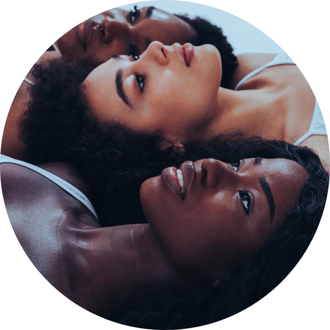 Three beautiful black young women posing looking awfully at ceiling