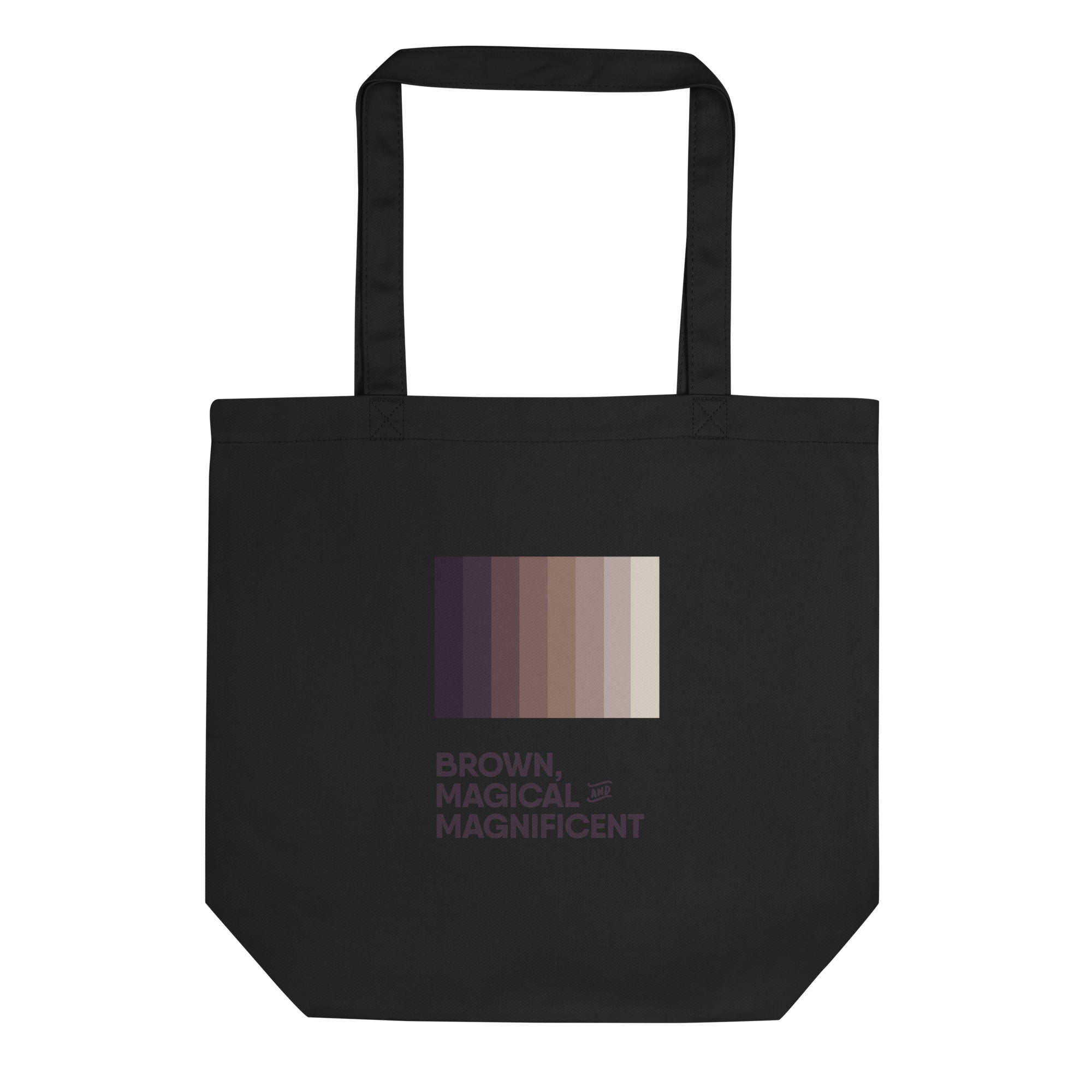 A black eco-tote bag featuring the empowering message "Brown, Magical, and Magnificent" in a gradient of brown tones.