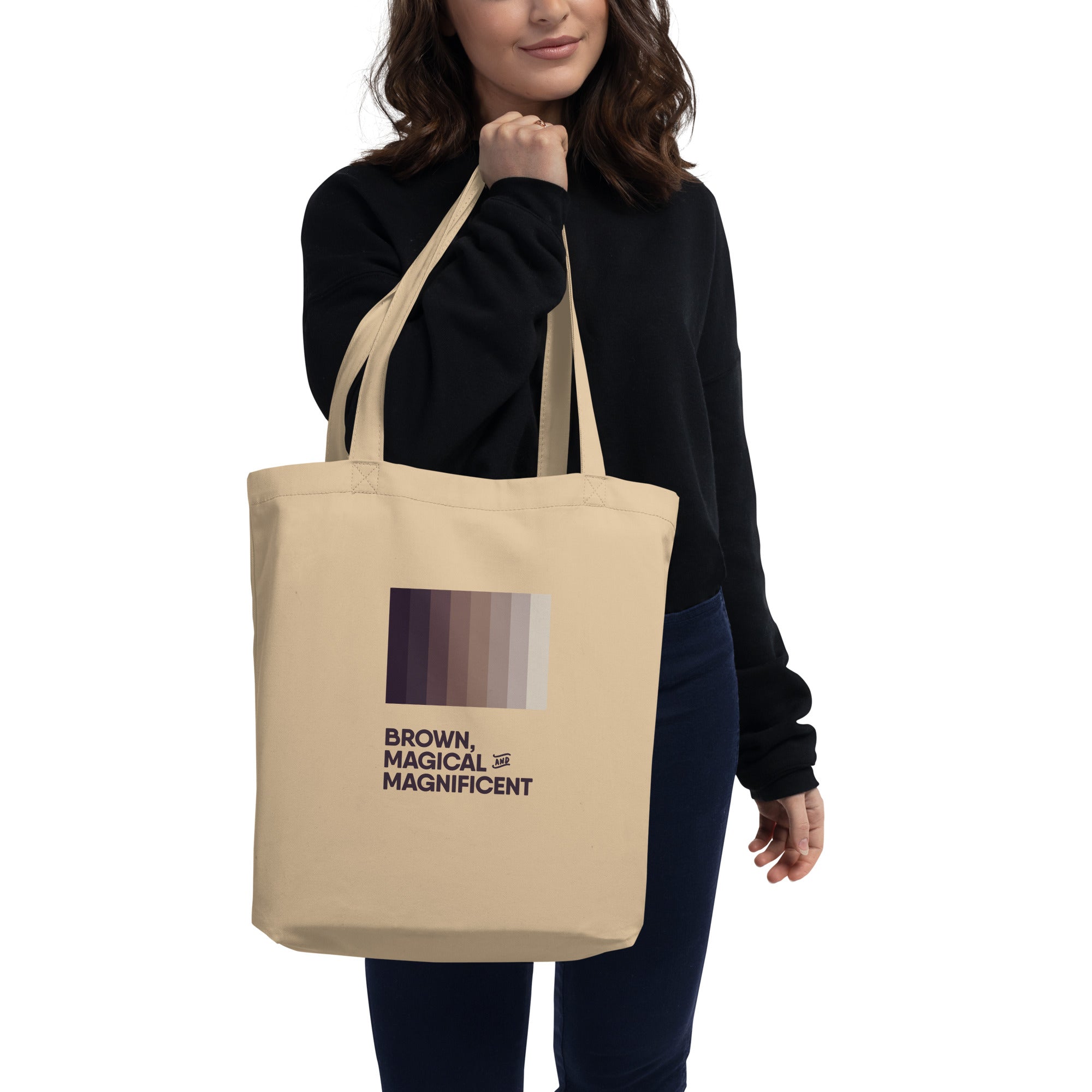 Woman holding a canvas tote bag with a decal of brown color pallete in shades of dark brown to light brown