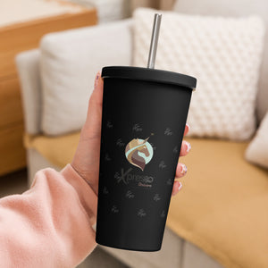 Black Xpresso Unicorn tumbler with a straw, held in someone's hand. Perfect for staying hydrated on the go.