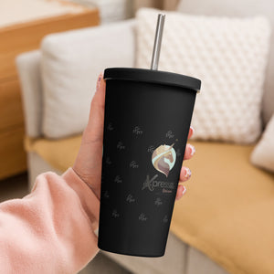 Close-up: A hand grips a black insulated tumbler with a straw. The Xpresso Unicorn logo is subtly visible on the cup.