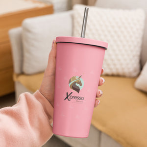 Pink Xpresso Unicorn tumbler with a straw, held in someone's hand. Perfect for staying hydrated on the go.