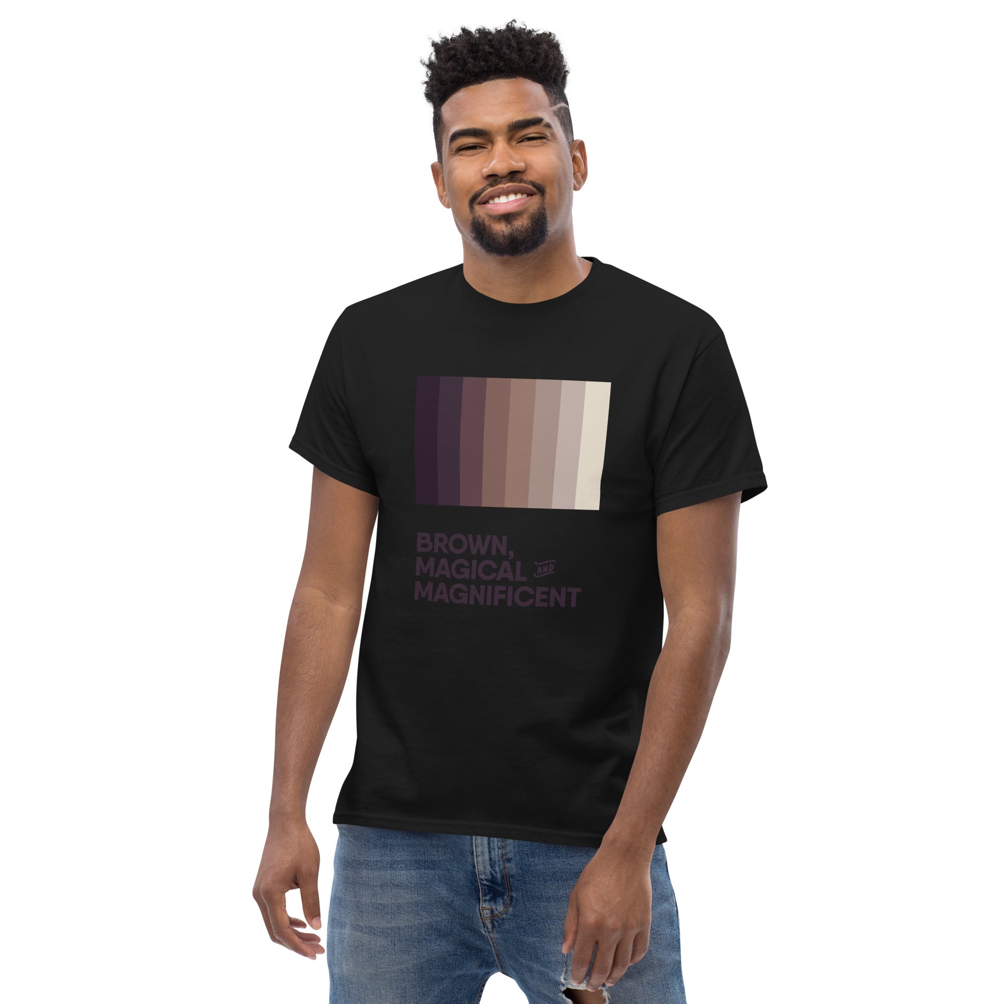 A Black man wearing a black shirt with a brown color gradient and the text "Brown, Magical, and Magnificent.