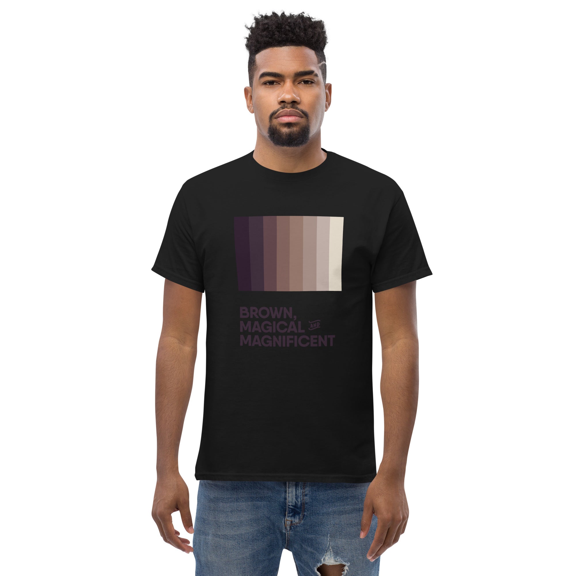 A Black man wearing a black shirt with a brown color gradient and the text "Brown, Magical, and Magnificent.