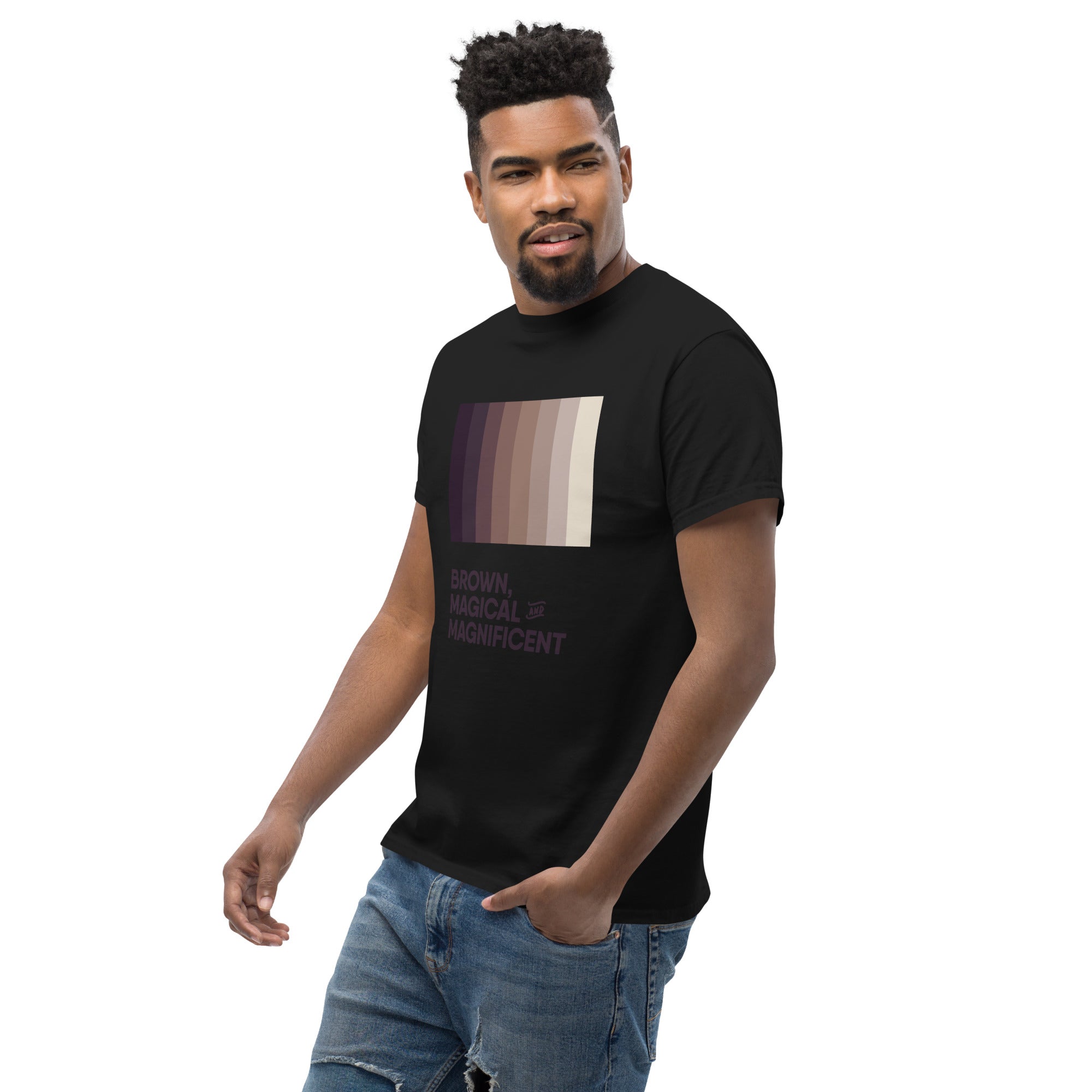 A Black man wearing a black shirt with a brown color gradient and the text "Brown, Magical, and Magnificent.