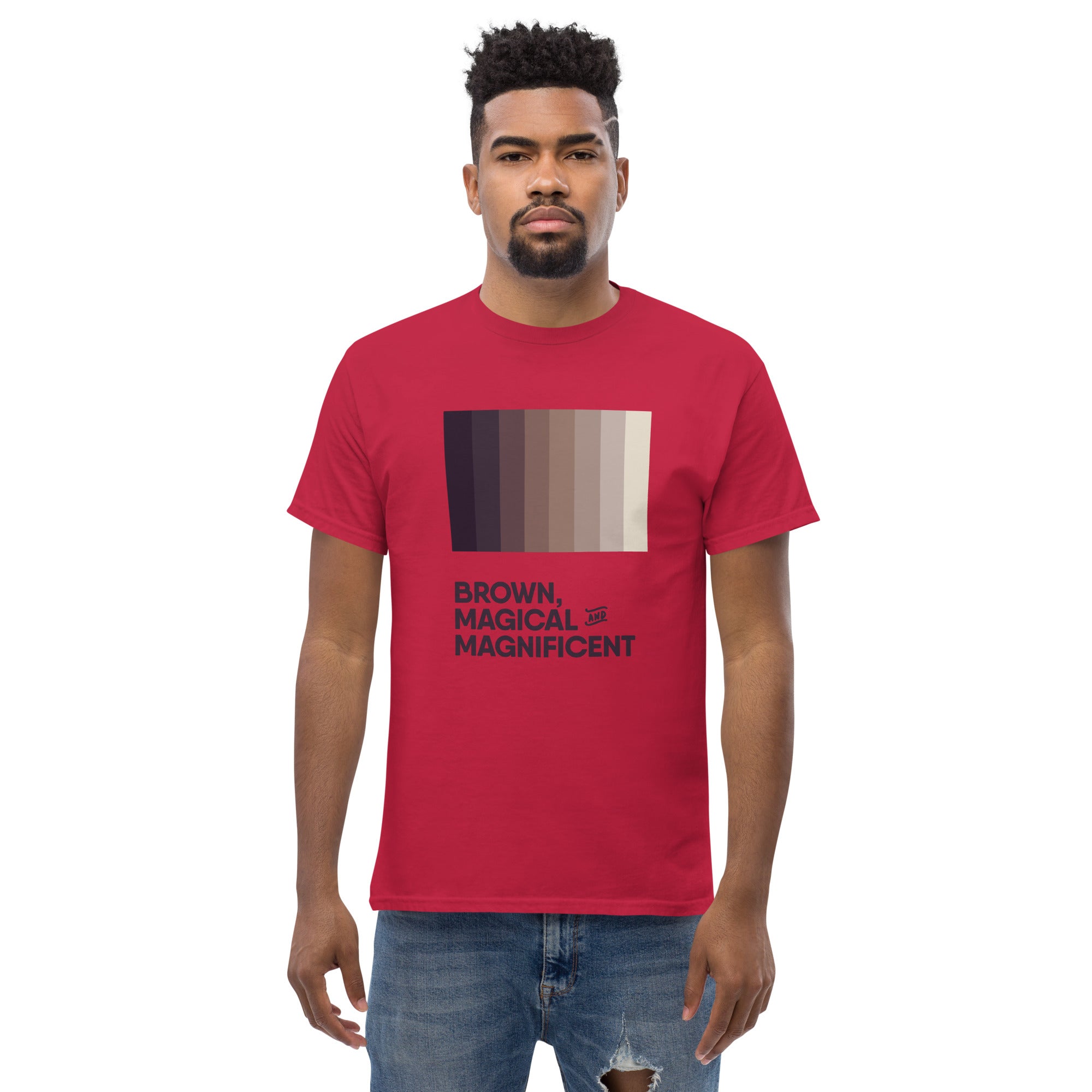 A Black man wearing a cardinal red shirt with a brown color gradient and the text "Brown, Magical, and Magnificent.