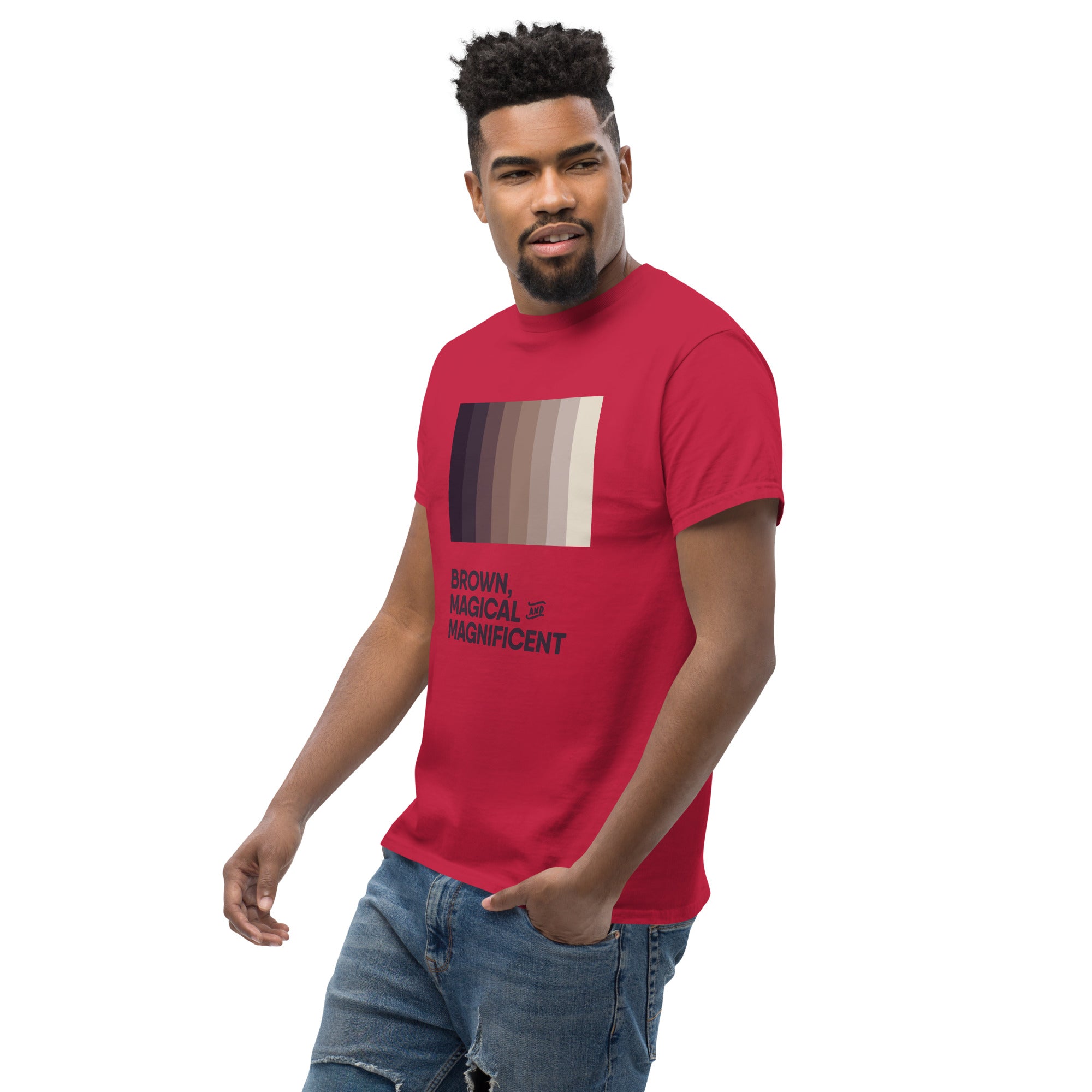 A Black man wearing a cardinal red shirt with a brown color gradient and the text "Brown, Magical, and Magnificent.