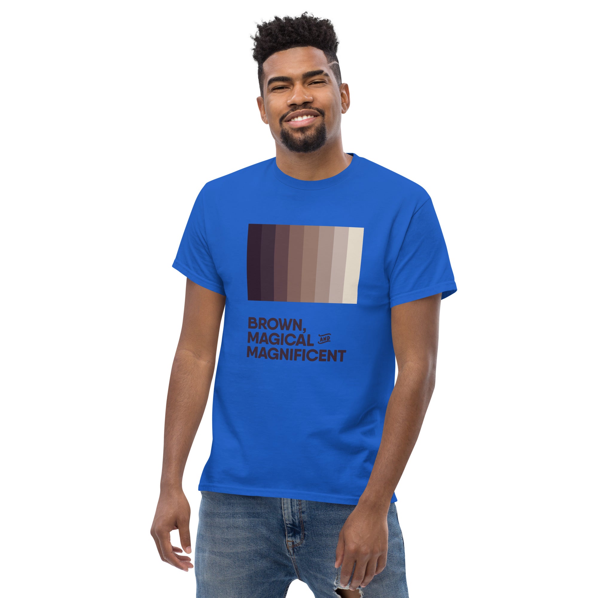 A Black man wearing a royal blue shirt with a brown color gradient and the text "Brown, Magical, and Magnificent.