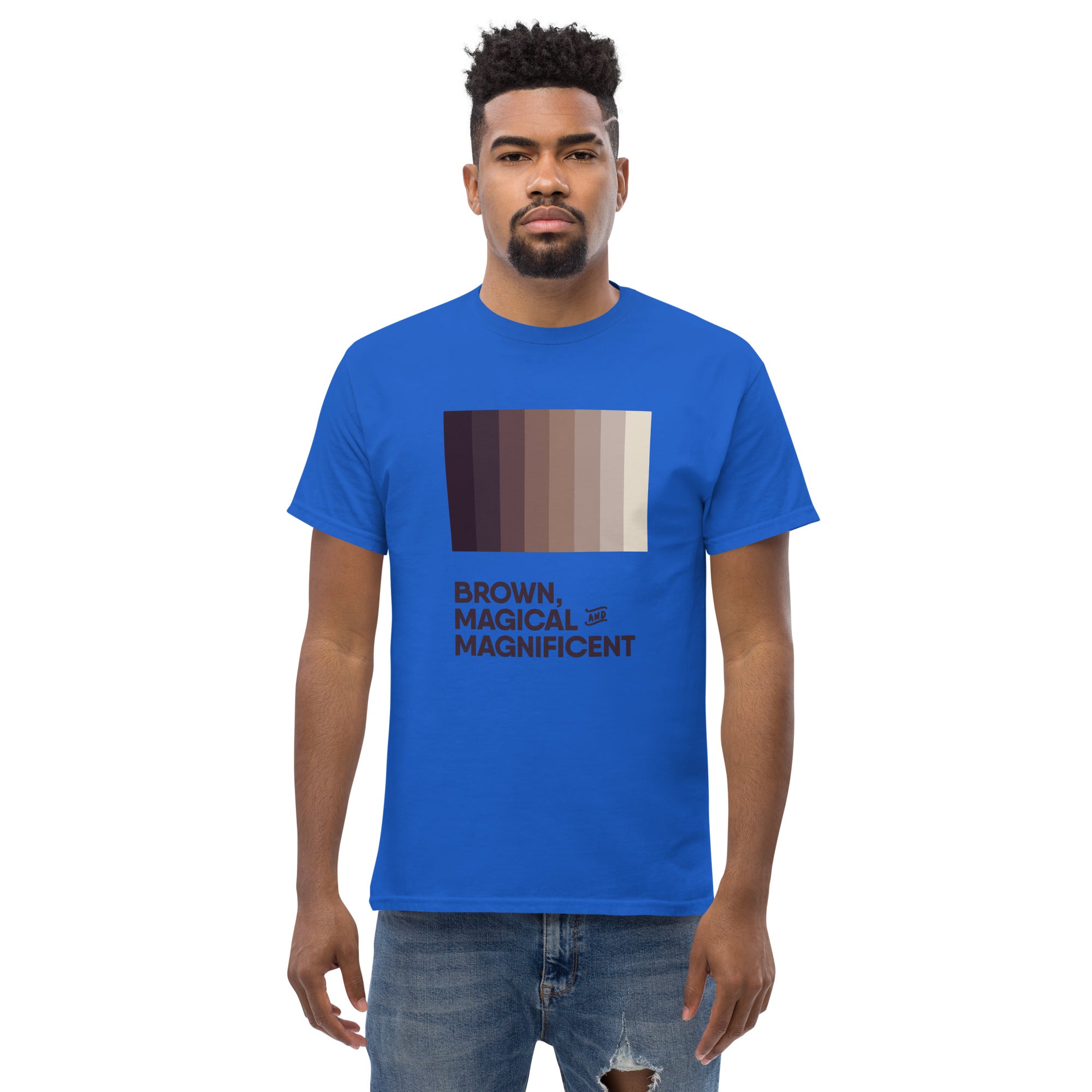 A Black man wearing a royal blue shirt with a brown color gradient and the text "Brown, Magical, and Magnificent.