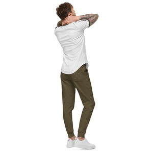 A man with tattoo sleeves wearing military green fleece sweatpants.