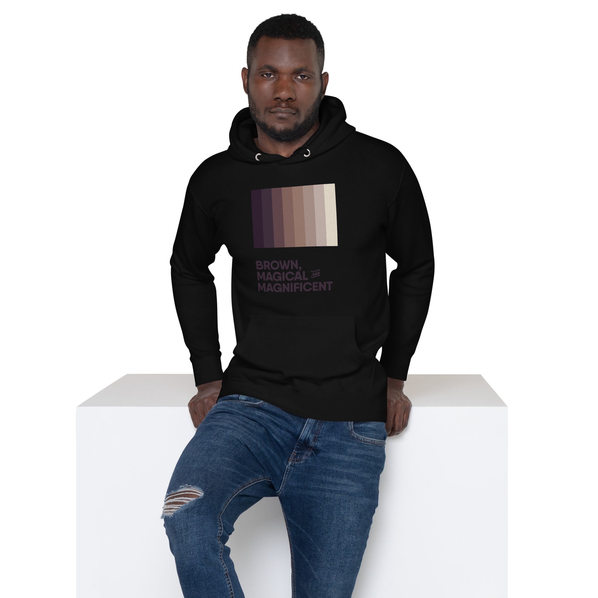 A Black man in a white hoodie featuring a beautiful brown color gradient and the empowering message "Brown, Magical, and Magnificent.