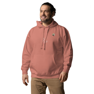 A man wearing a dusty rose hoodie with the Xpresso Unicorn logo.