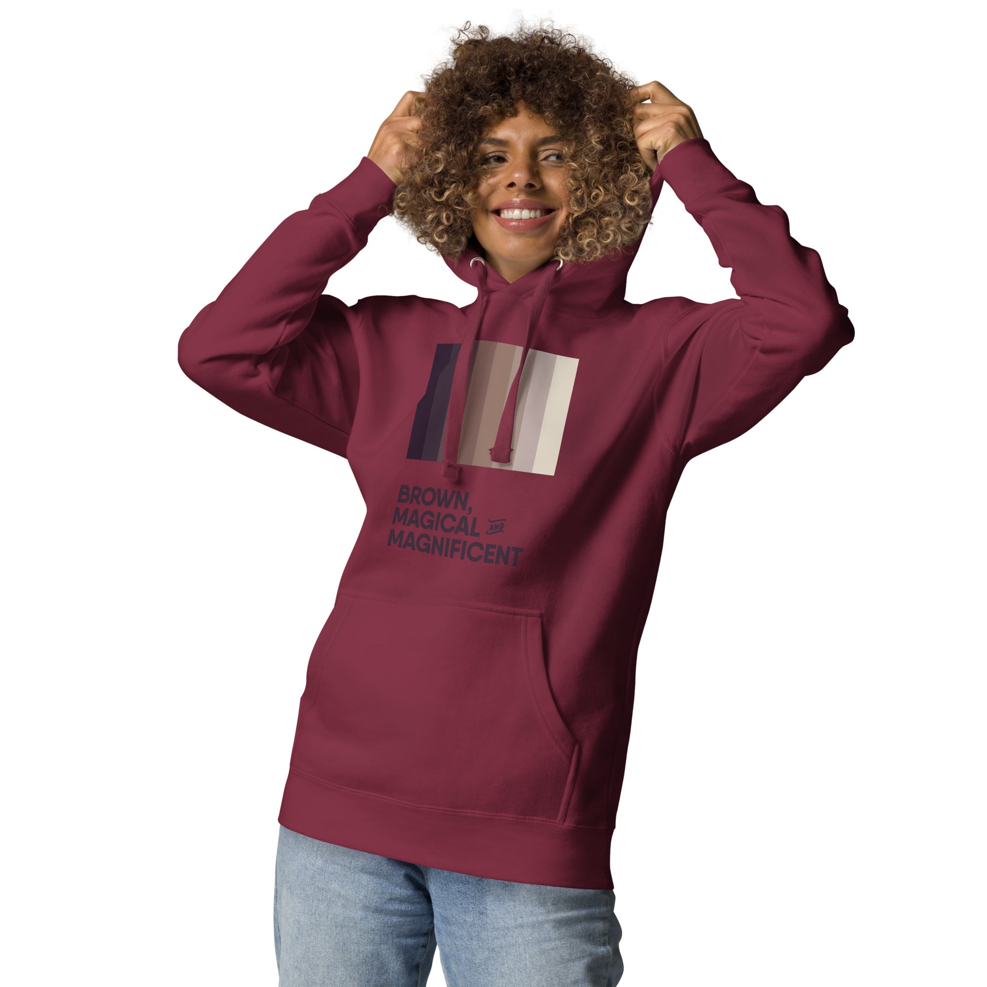 A Black woman in a maroon hoodie featuring a beautiful brown color gradient and the empowering message "Brown, Magical, and Magnificent."