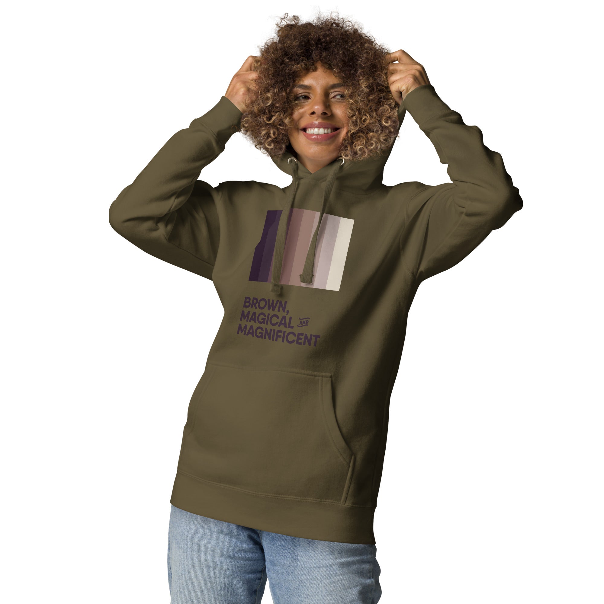 A Black woman in a military green hoodie featuring a beautiful brown color gradient and the empowering message "Brown, Magical, and Magnificent.