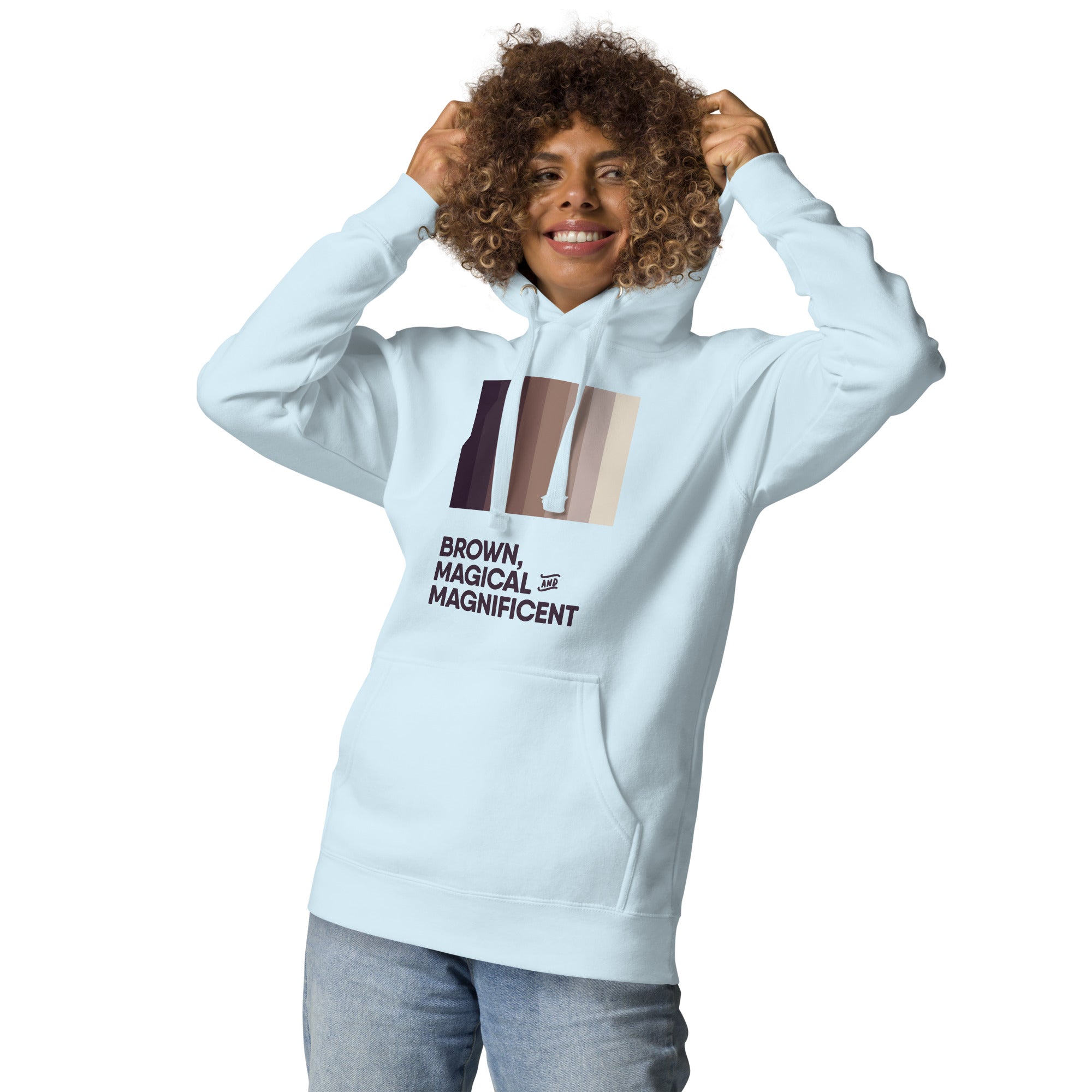 A Black woman in a sky blue hoodie featuring a beautiful brown color gradient and the empowering message "Brown, Magical, and Magnificent."