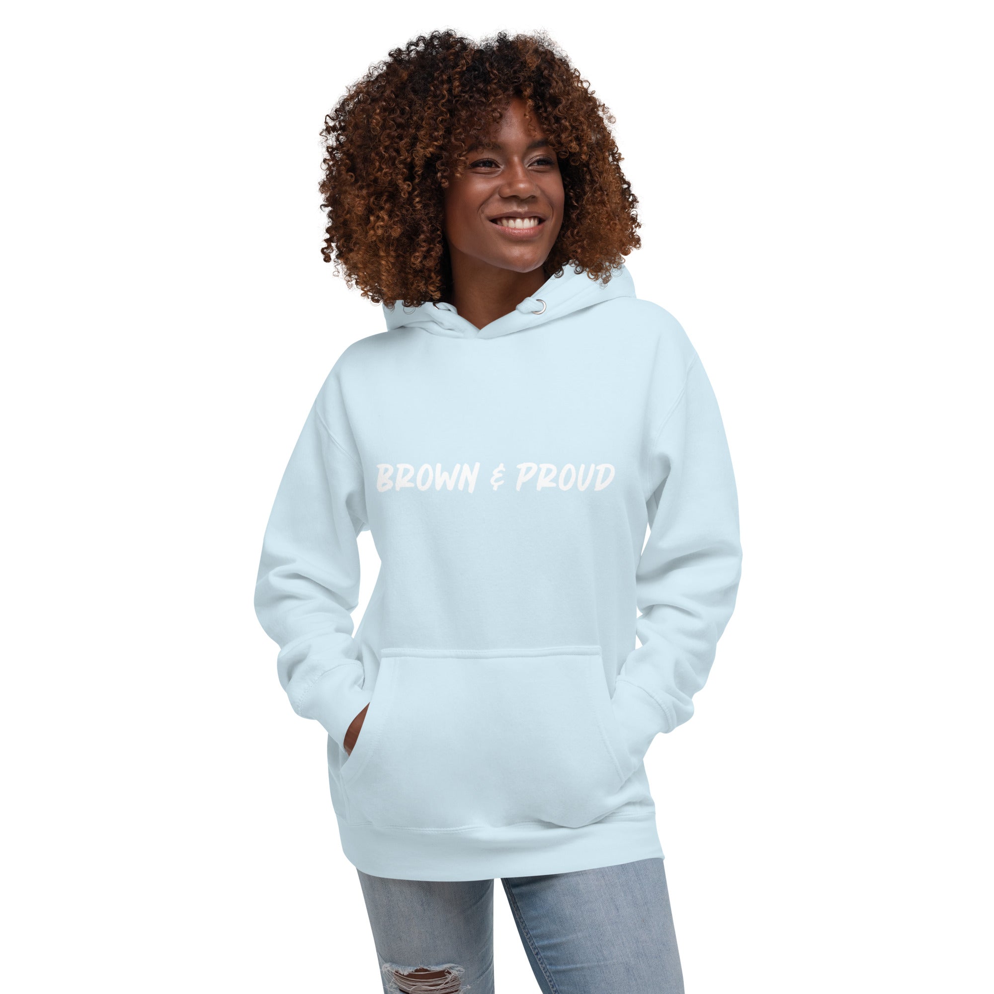 Sky blue hoodie with "Brown & Proud" in white lettering, modeled by a Black woman. A perfect way to express pride in your heritage.